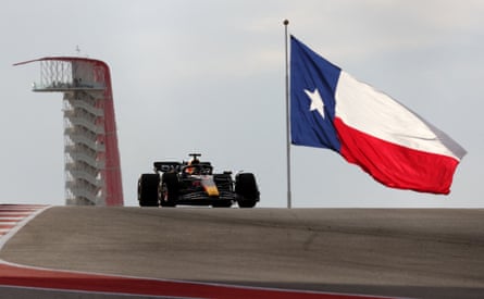 Red Bull's Max Verstappen leads the field during Saturday’s F1 sprint race with the flag of Texas pictured in the background.