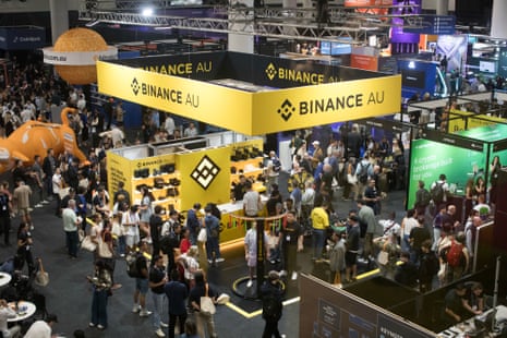 A crowd gathers at the Binance booth during a crypto convention in Sydney