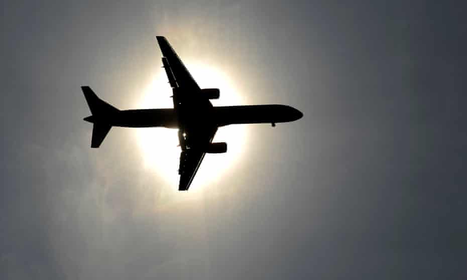 Plane approaching Leeds Bradford airport in England passes in front of the sun on 26 May 2013