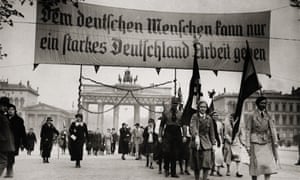 1931: National socialist demonstration in Berlin. The banner reads ‘Only a strong Germany can provide employment to its people’.