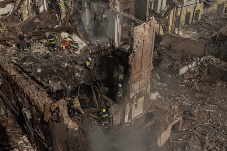 Aerial view of rescuers working at the site of heavily damaged buildings in Dnipro.
