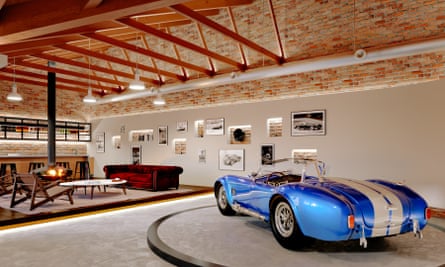 A vintage car is displayed on a turntable in a Garage Deluxe design.