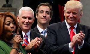 Michael Cohen stands behind Donald Trump and Mike Pence at a campaign event in Cleveland in 2016.