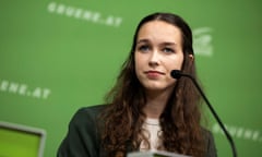 Lena Schilling at a press conference in Vienna against a green background