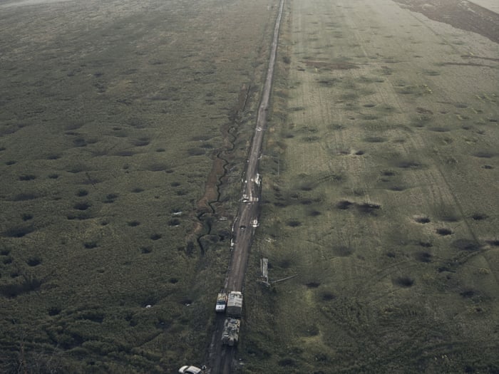 A field is covered with craters left by shelling close to Izium, in the Kharkiv region.