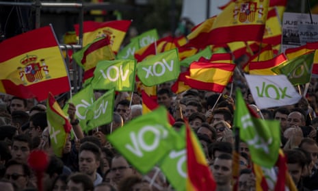 Supporters of far-right party Vox wave Spanish and Vox flags in the air in Madrid, Spain.