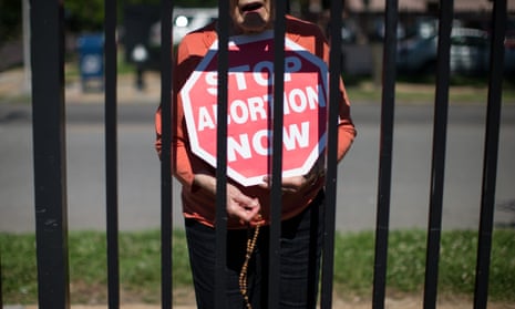 An abortion opponent protests outside Planned Parenthood in St Louis.