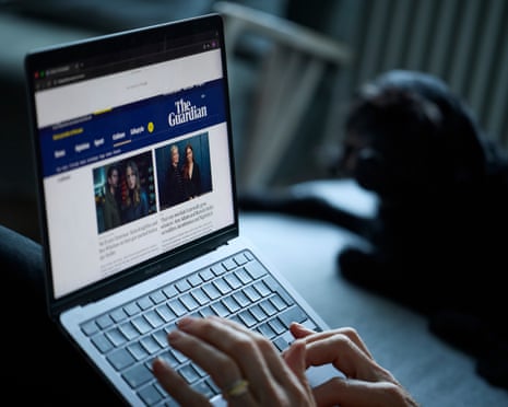 The Guardian website open on a laptop