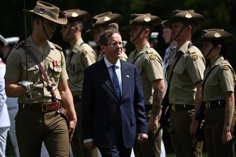 Israeli president Isaac Herzog inspects a guard of honour during a ceremonial welcome at Government House in Canberra