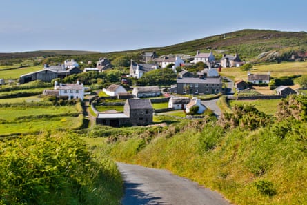 Old village on green hillsides on a bright day