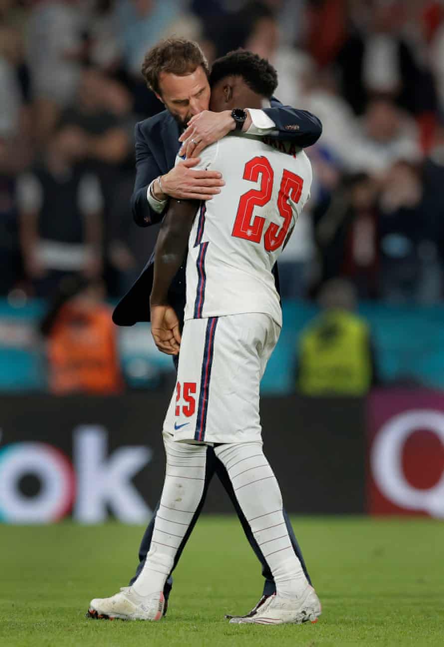 England manager Gareth Southgate consoles his player Bukayo Saka after his decisive miss in the penalty shootout gave Italy victory during the Italy v England Euro 2020 final at Wembley Stadium on July 11th 2021.