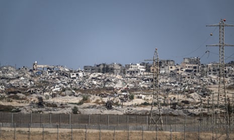 The destruction caused by the Israeli attacks on Gaza is viewed from the Nir Am region in southern Israel.