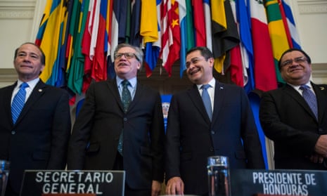 The President of Honduras, Juan Orlando Hernández (second right) stands alongside, Luis Almagro, secretary general of the OAS, during a ceremony establishing the anti-corruption body Maccih in Washington on Tuesday.