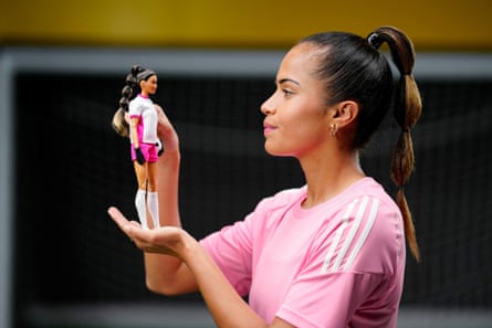 Mary Fowler poses with her Barbie doll.