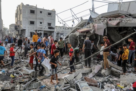Civil defense teams and civilians conduct a search and rescue operation under the rubbles of demolished buildings following the Israeli attacks in Rafah, Gaza on November 11, 2023.