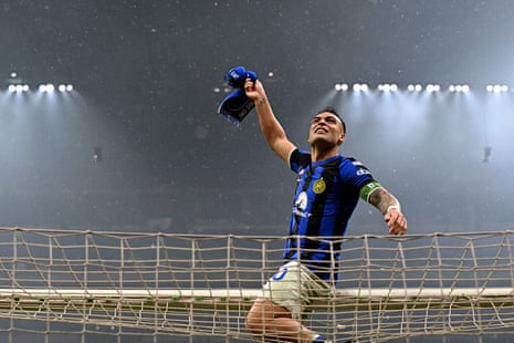 Inter Milan's Argentine forward Lautaro Martinez climbs onto the crossbar.