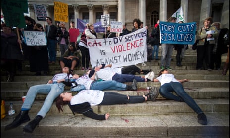 Direct action stunt by Sisters Uncut, a UK-wide feminist group whose members take direct action locally to defend domestic violence services, outside Portsmouth's Guildhall.