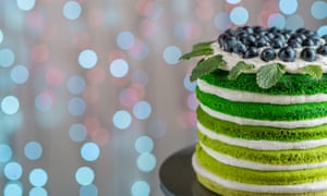 Nice sponge happy birthday cake with mascarpone and grapes on the cake stand on festive light bokehEFC4JG Nice sponge happy birthday cake with mascarpone and grapes on the cake stand on festive light bokeh
