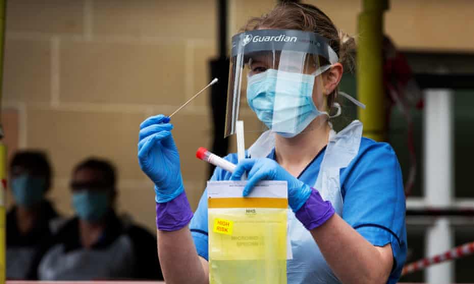 A nurse holds a coronavirus testing kit at an Edinburgh hospital.