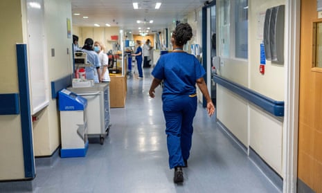 Staff on a NHS hospital ward at Ealing hospital in London. 