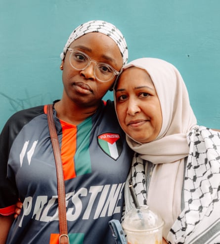 Two women in headscarves and Palestine gear