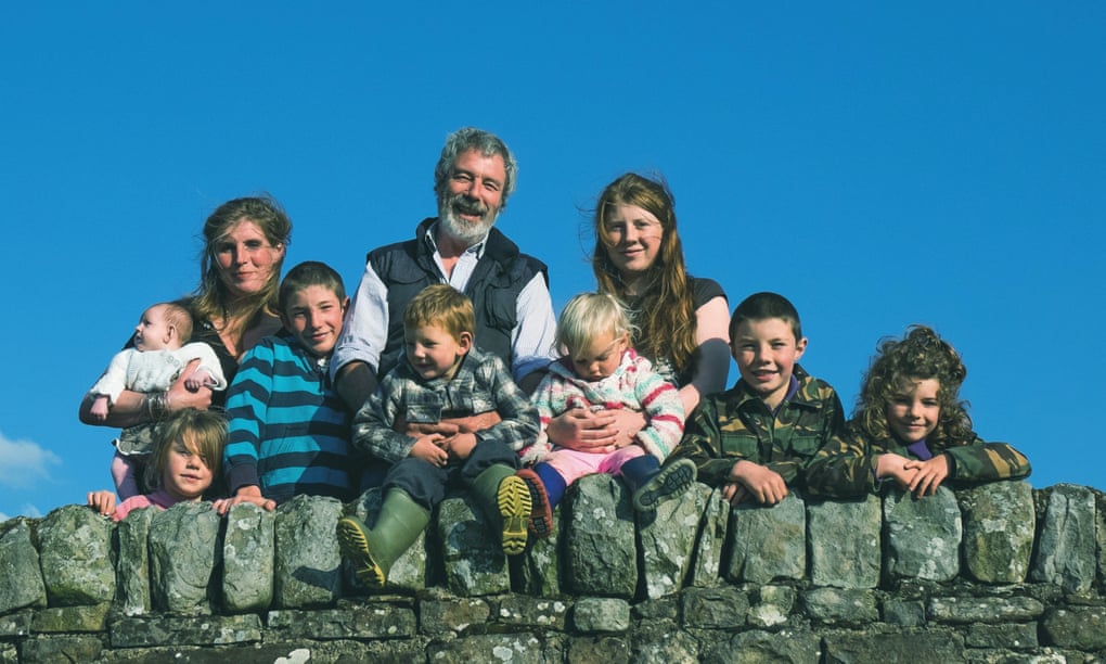 Amanda and Clive Owen with eight of their children at their Yorkshire Dales farm, Ravenseat.