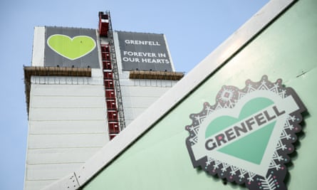 The exterior of Grenfell Tower, with heart symbols.