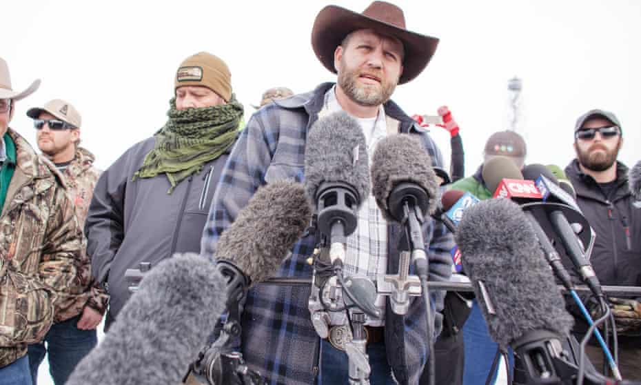 Ammon Bundy speaks to the media as other members look on at the Malheur National Wildlife Refuge near Burns, Oregon.