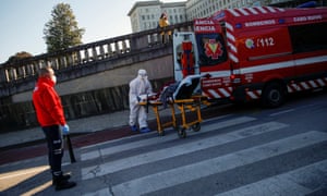 An ambulance carrying a Covid patient is seen outside Santa Maria Hospital in Lisbon, Portugal.