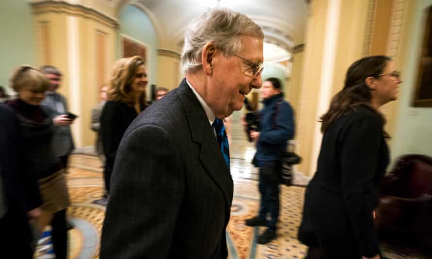 Mitch McConnell walks to the Senate floor over the weekend.