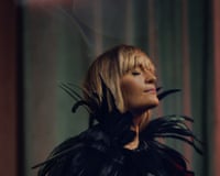 Ruby Hughes wearing a black feathered outfit