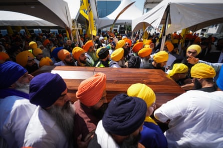Mourners carry the casket of the Sikh community leader and temple president Hardeep Singh Nijjar in Surrey, British Columbia, Canada on 25 June 2023.