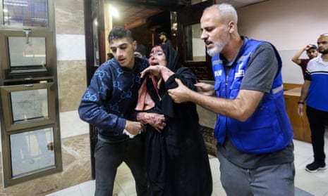 A Palestinian injured in an Israeli airstrike arrives at Nasser Medical Complex.