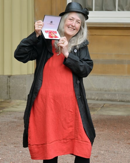 Beard receiving an OBE medal at Buckingham Palace in 2013.