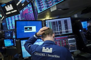 The trader is working on his desk during the closing of the floor bell on the New York Mercantile Exchange last night