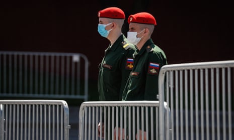 Russian military personnel wearing masks near Red Square in Moscow