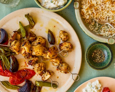 A plate of Chicken Shish Kebabs with Roasted Vegetables, with top right a bowl of Turkish-style rice pilaf
