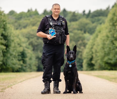 PD Stark with his handler, PC Paul Hopley, and his Thin Blue Paw award.