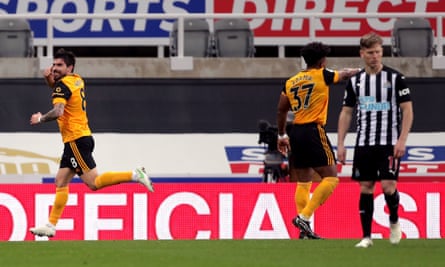 Rúben Neves celebrates scoring Wolves’ equaliser while Matt Ritchie is disconsolate