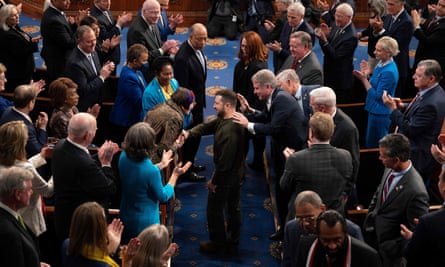 Ukraine’s president Volodymyr Zelenskiy is greeted by Congress members as he arrives to address them in December.