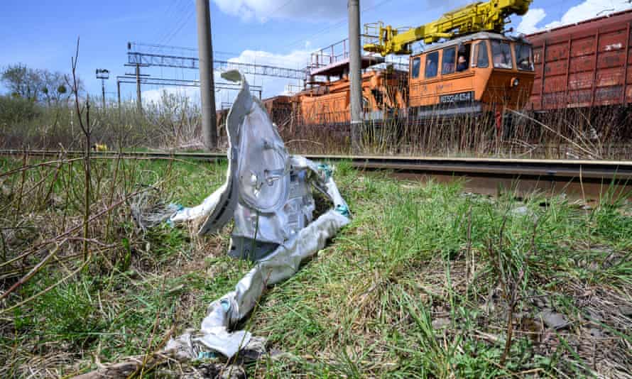Shards of twisted metal from a Russian rocket are in undergrowth near a train line near Lviv