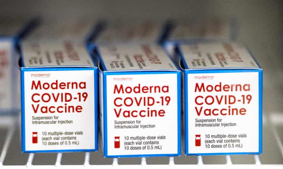 Boxes containing vials of the Moderna Covid-19 vaccine sit in a refrigerator at Augusta University in Augusta, Georgia.
