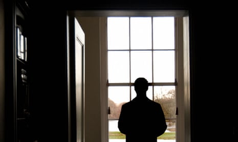 A man standing in front of a window