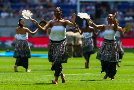 Fijians in national dress parade before kick-off in a scorching Merseyside.
