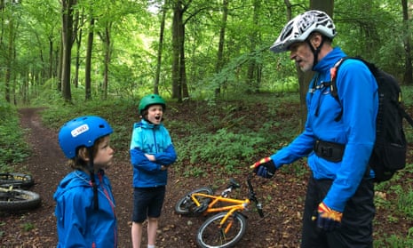 Mountain biking in the Houghton Forest, West Sussex. The writer’s children hang on every word of guide, Jim Barrow.