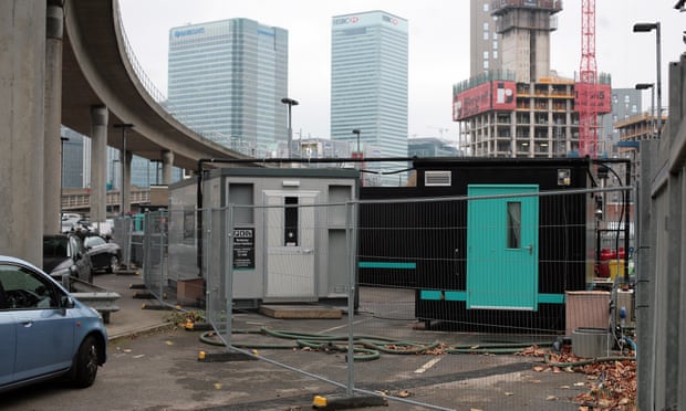 Deliveroo’s dark kitchens under a railway line in Blackwall, east London, in the shadow of Canary Wharf’s gleaming office towers.