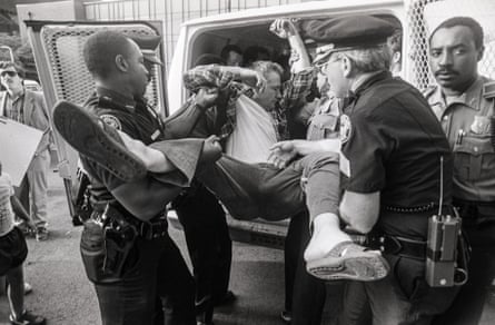Police load pro-life protesters into a van in Atlanta, Georgia, in August 1988.
