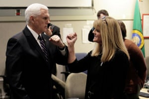 This is Pence making sure not to shake hands when greeting a woman at the Washington State Emergency Operations Center during a tour with state governor Jay Inslee near Tacoma, Washington state, yesterday.
