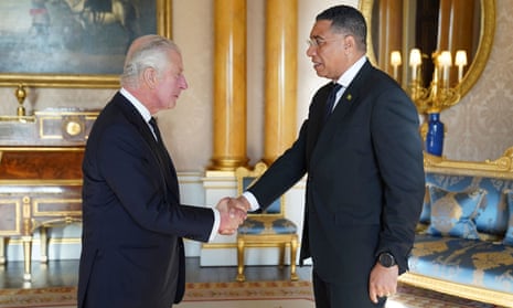 King Charles III shakes hands with Andrew Holness, prime minister of Jamaica, at Buckingham Palace in London, September 2022.