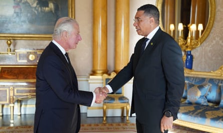 Andrew Holness shakes hands with King Charles at Buckingham Palace